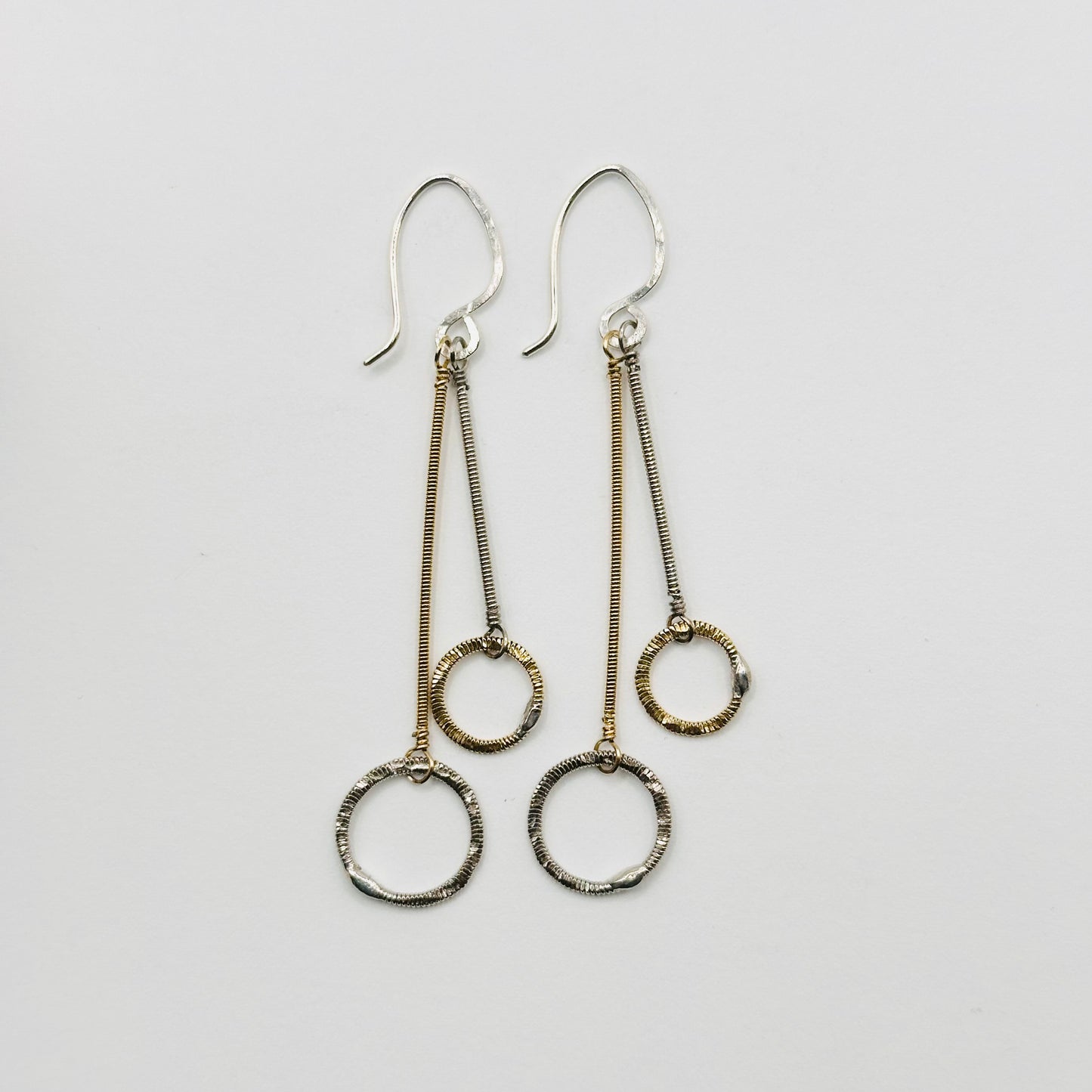 Double Strings with Hammered Circles